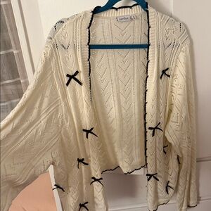 Torrid Love Riche Cream Cardigan with Black Bow Details